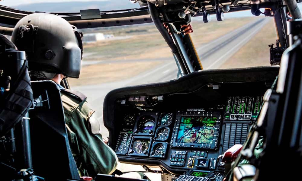 Pilot operating military helicopter